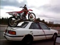 Dirt-Bike-On-Car-Falls-Off.jpg