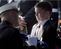 soldier-handing-flag-boy.jpg